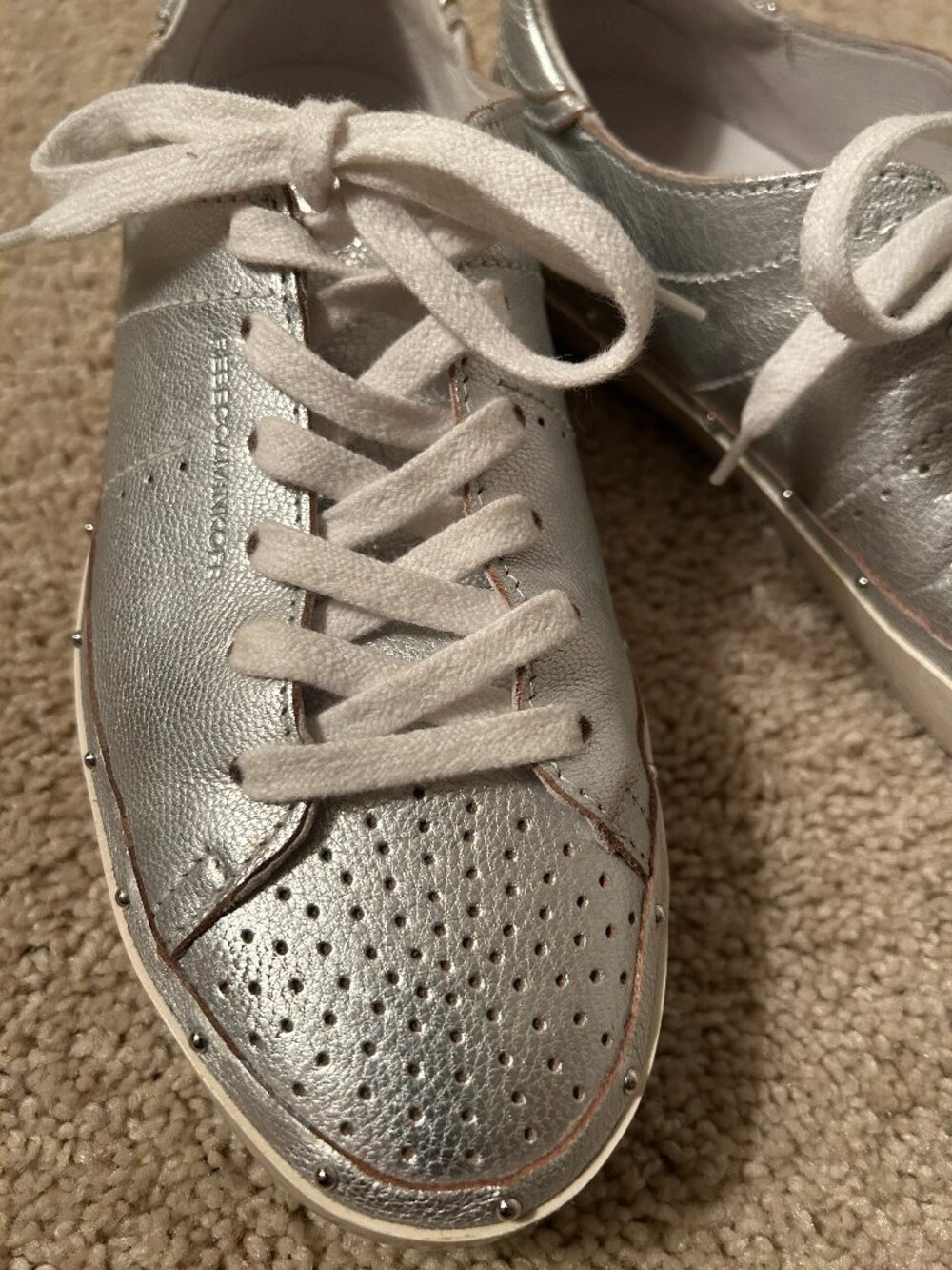 Rebecca Minkoff silver studded sneakers.